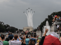 WASHINGTON, DC - JULY 04: People react to a military fly over on the National Mall while President Donald Trump gives his speech during Fourth of July festivities on July 4, 2019 in Washington, DC. President Trump is holding a "Salute to America" celebration on the National Mall on Independence …