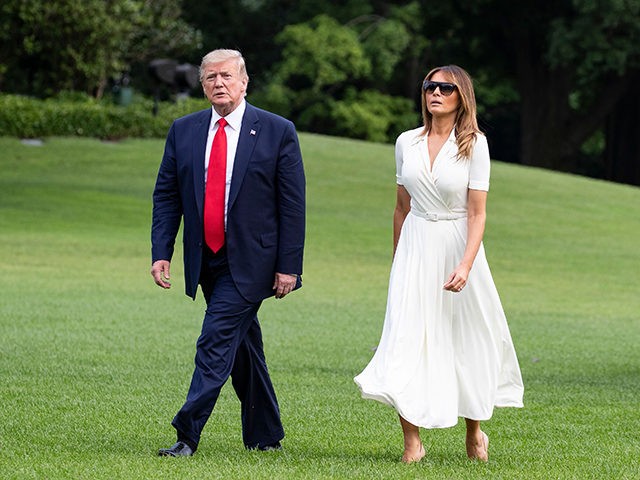 US President Donald Trump and First Lady Melania Trump step off Marine One after returning to the White House in Washington, DC on July 7, 2019. - Trump is returning to Washington after spending the weekend at his Bedminster golf resort. (Photo by Alex Edelman / AFP) (Photo credit should …