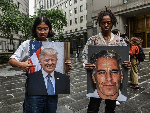 NEW YORK, NY - JULY 08: A protest group called "Hot Mess" hold up signs of Jeffrey Epstein