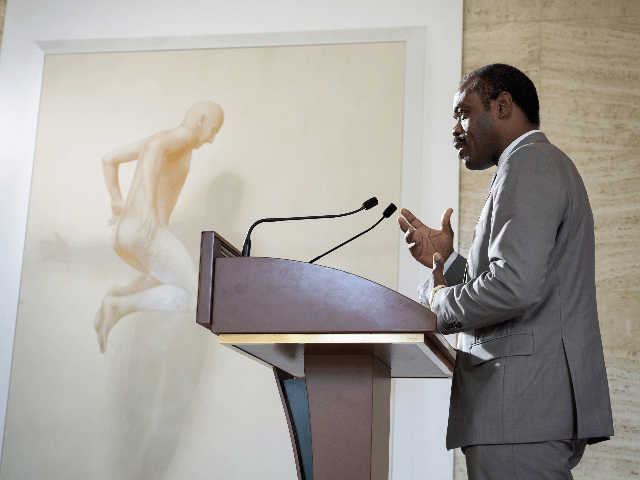 Congo's Health Minister Oly Ilunga gestures as he speaks during a press conference followi