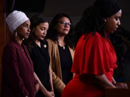 US Representatives Ayanna Pressley (D-MA) speaks as, Ilhan Abdullahi Omar (D-MN)(L), Rashi