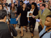 U.S. Rep Alexandria Ocasio-Cortez (D-NY) answers questions after a press conference at the U.S. Capitol on July 15, 2019 in Washington, DC. President Donald Trump stepped up his attacks on four progressive Democratic congresswomen, saying if they're not happy in the United States "they can leave." (Photo by Alex Wroblewski/Getty …