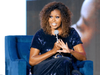 Michelle Obama speaks onstage during the 2019 ESSENCE Festival Presented By Coca-Cola at Louisiana Superdome on July 06, 2019 in New Orleans, Louisiana. (Photo by Bennett Raglin/Getty Images for ESSENCE)