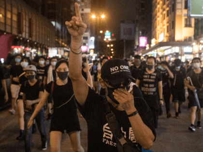 HONG KONG, HONG KONG - JULY 07: Protesters march towards the Mong Kok district after atten