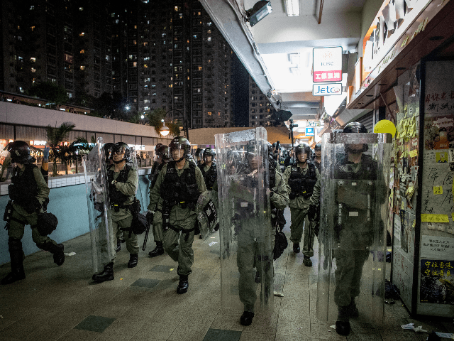 Riot police chase protesters through a shopping mall as they clash with protesters after t