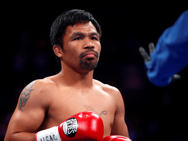 Manny Pacquiao gets ready for the start of his WBA welterweight title fight against Keith