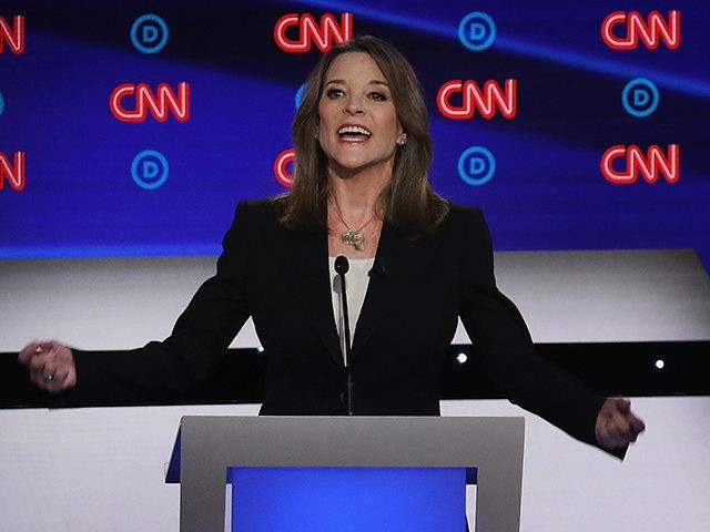 DETROIT, MICHIGAN - JULY 30: Democratic presidential candidate Marianne Williamson speaks while Rep. Tim Ryan (D-OH) listens during the Democratic Presidential Debate at the Fox Theatre July 30, 2019 in Detroit, Michigan. 20 Democratic presidential candidates were split into two groups of 10 to take part in the debate sponsored …