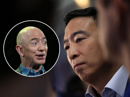 (INSET: Amazon founder Jeff Bezos) DETROIT, MICHIGAN - JULY 31: Democratic presidential candidat former tech executive Andrew Yang speaks to the media in the spin room after the Democratic Presidential Debate at the Fox Theatre July 31, 2019 in Detroit, Michigan. 20 Democratic presidential candidates were split into two groups …