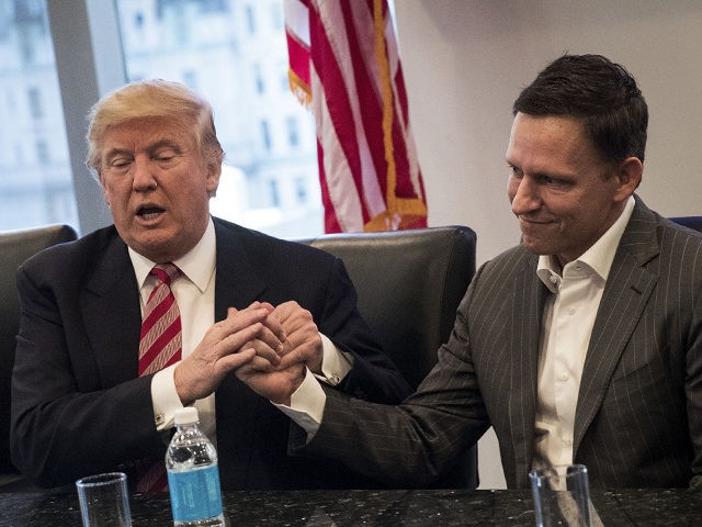 NEW YORK, NY - DECEMBER 14: (L to R) Vice President-elect Mike Pence looks on as President-elect Donald Trump shakes the hand of Peter Thiel during a meeting with technology executives at Trump Tower, December 14, 2016 in New York City. This is the first major meeting between President-elect Trump …