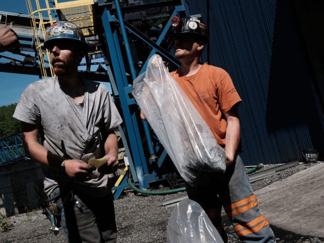WELCH, WV - MAY 19: Men take coal samples at a coal prep plant on May 19, 2017 outside the