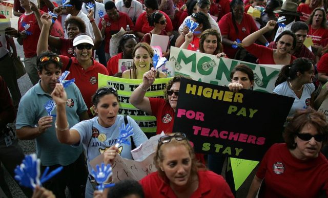 MIAMI - OCTOBER 11: Miami-Dade County school teachers protest for higher wages saying they