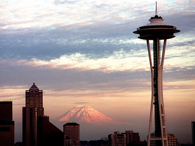 370258 05: The Seattle Space Needle is viewed during dusk with Mt. Rainier in the background May 30, 2000 in Seattle, WA. (Photo by Dan Callister/Newsmakers)