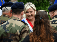 Far-right Front National (FN) party member of parliament Marine Le Pen speaks with military personnel as she attend the annual Bastille Day celebrations in Henin-Beaumont, northwestern France on July 14, 2017. / AFP PHOTO / FRANCOIS LO PRESTI (Photo credit should read FRANCOIS LO PRESTI/AFP/Getty Images)
