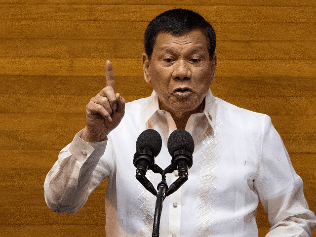 Philippine President Rodrigo Duterte gestures as he delivers his state of the nation address at Congress in Manila on July 24, 2017. Philippine President Rodrigo Duterte vowed July 24 to press on with his controversial drug war that has claimed thousands of lives, as he outlined his vision of an …