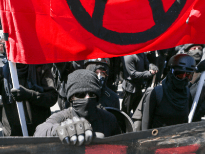 Antifa members and counter protesters gather during a rightwing No-To-Marxism rally on Aug