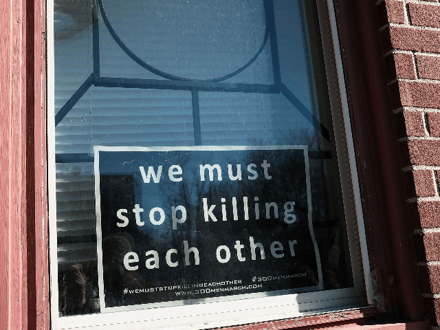 BALTIMORE, MD - FEBRUARY 03: A sign to end violence sits in a window in a neighborhood with a high murder rate on February 3, 2018 in Baltimore, Maryland. Baltimore, one of the poorest major cities in the United States, experienced 341 homicides last year, the highest per-capita rate on …