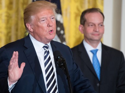 US President Donald Trump speaks alongside Secretary of Labor Alexander Acosta (R) during the National Teacher of the Year reception in the East Room of the White House in Washington, DC, May 2, 2018. (Photo by SAUL LOEB / AFP) (Photo credit should read SAUL LOEB/AFP/Getty Images)
