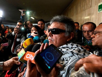 Common Alternative Revolutionary Force (FARC) party member Jesus Santrich (R), wanted by t