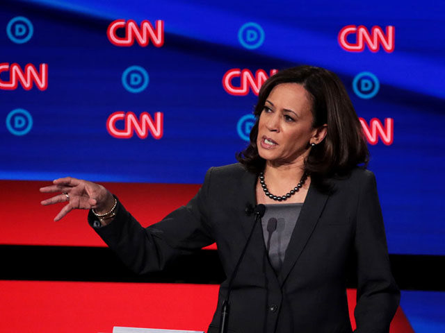 DETROIT, MICHIGAN - JULY 31: Democratic presidential candidate Sen. Kamala Harris (D-CA) (R) speaks during the Democratic Presidential Debate at the Fox Theatre July 31, 2019 in Detroit, Michigan. 20 Democratic presidential candidates were split into two groups of 10 to take part in the debate sponsored by CNN held …