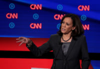 DETROIT, MICHIGAN - JULY 31: Democratic presidential candidate Sen. Kamala Harris (D-CA) (R) speaks during the Democratic Presidential Debate at the Fox Theatre July 31, 2019 in Detroit, Michigan. 20 Democratic presidential candidates were split into two groups of 10 to take part in the debate sponsored by CNN held …