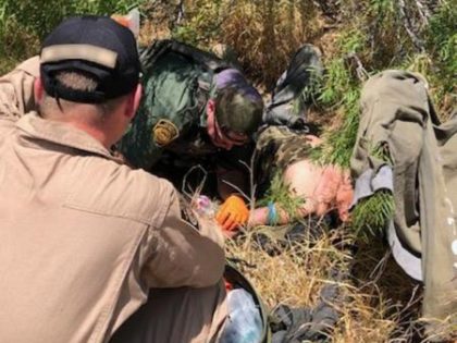 Laredo Sector Border Patrol agents administer IV fluids to a lost migrant suffering from d