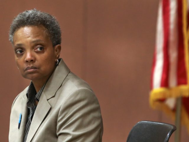 In this March 24, 2019 photo, Chicago mayoral candidate Lori Lightfoot listens to a question during a candidate forum sponsored by One Chicago For All Alliance at Daley College in Chicago. Lightfoot and Toni Preckwinkle are competing to make history by becoming the city's first black, female mayor. On issues â€¦