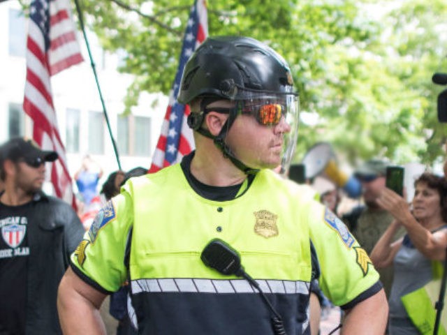 BOSTON, MA - AUGUST 18: Police separate participants in the rally organized by Boston Free
