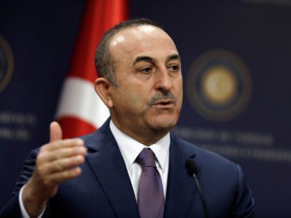 Turkish Foreign Minister Mevlut Cavusoglu speaks during a joint news conference with Belgium's Foreign Minister Didier Reynders, in Ankara, Turkey, Tuesday, April 23, 2019.(AP Photo/Burhan Ozbilici)