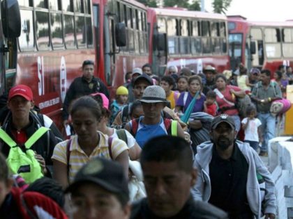 Migrants Board busses to US