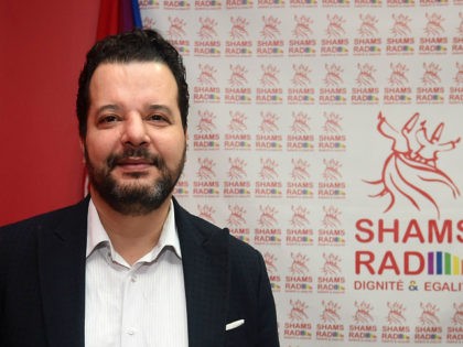 Tunisian lawyer Mounir Baatour (L), president of the association "Shams" which supports the depenalization of homosexuality in Tunisia and president of "Shams Radio", the first LGBT radio in the Arab region, poses in the studio as he arrives for the opening of the radio station on December 18, 2017 in …