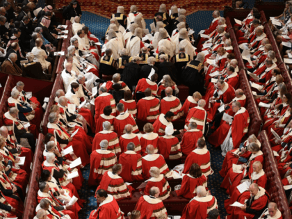 Peers take their seats in the House of Lords ahead of the State Opening of Parliament in the Houses of Parliament in London on June 21, 2017. Queen Elizabeth II will formally open parliament and announce the British government's legislative programme on Wednesday, two days later than planned. The state …