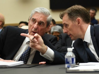 Former Deputy Special Counsel Aaron Zebley (R) confers with former Special Prosecutor Robert Mueller during a hearing before Congress on July 24, 2019, in Washington, DC. - Three months after releasing the final report on his probe into the 2016 election, much of the American public remains unclear about the …