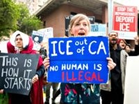 eople protest outside a speech by Attorney General Jeff Sessions March 7, 2018, in Sacramento. (Credit: NOAH BERGER/AFP/Getty Images)