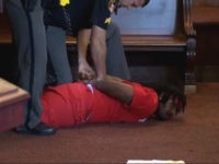 Two brothers arrested after courtroom attack.