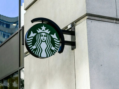 A Starbucks logo hangs over a store entrance in Washington, DC June 11, 2019. (Photo by EVA HAMBACH / AFP) (Photo credit should read EVA HAMBACH/AFP/Getty Images)