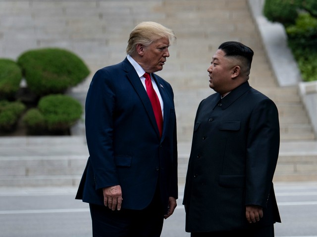 US President Donald Trump and North Korea's leader Kim Jong-un stand on North Korean soil while walking to South Korea in the Demilitarized Zone(DMZ) on June 30, 2019, in Panmunjom, Korea. (Photo by Brendan Smialowski / AFP) (Photo credit should read BRENDAN SMIALOWSKI/AFP/Getty Images)