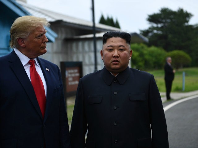 North Korea's leader Kim Jong Un stands with US President Donald Trump south of the Milita