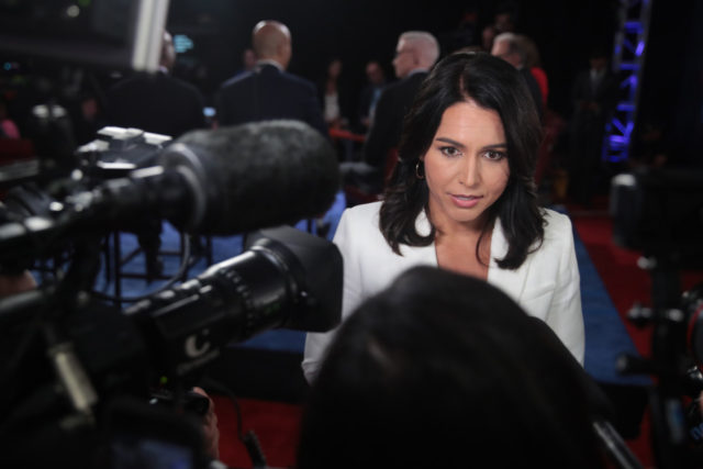 DETROIT, MICHIGAN - JULY 31: Democratic presidential candidate Rep. Tulsi Gabbard (D-HI) speaks to the media in the spin room after the Democratic Presidential Debate at the Fox Theatre July 31, 2019 in Detroit, Michigan. 20 Democratic presidential candidates were split into two groups of 10 to take part in …