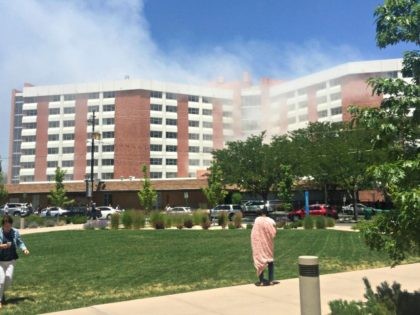 Plumes of smoke from an explosion inside a residence hall at the University of Nevada, Reno in Reno, Nev., is visible on Friday, July 5, 2019. Police referred to the incident as a "utilities accident." There were no immediate reports of injuries. (Raymond Floyd via The AP)