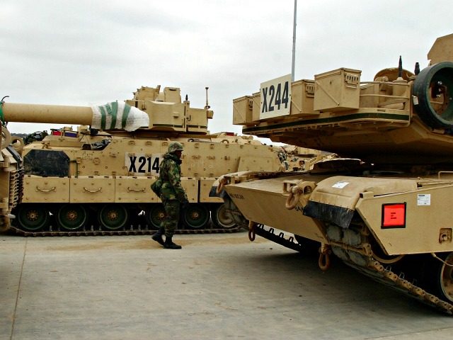 FT. HOOD, TX - JANUARY 22: A soldier walks among military vehicles ready for deployment to