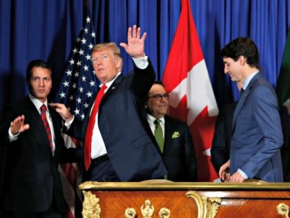 President Donald Trump, Canada's Prime Minister Justin Trudeau, right, and Mexico's President Enrique Pena Nieto, left, walk out after participating in the USMCA signing ceremony, Friday, Nov. 30, 2018 in Buenos Aires, Argentina. (AP Photo/Pablo Martinez Monsivais)