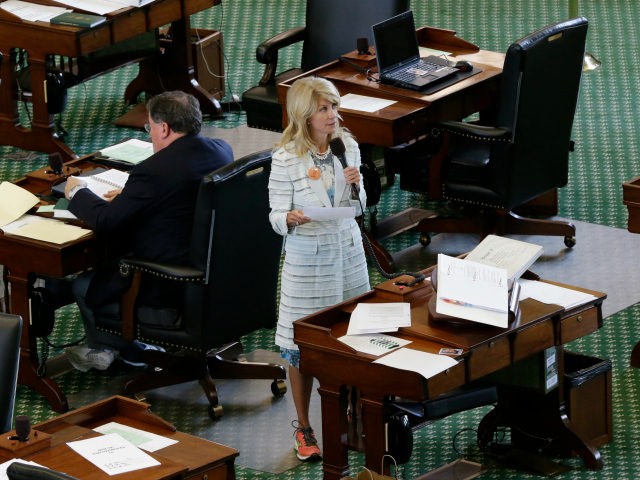 Sen. Wendy Davis, D-Fort Worth, stands on a near empty senate floor as she filibusters in an effort to kill an abortion bill, Tuesday, June 25, 2013, in Austin, Texas. The bill would ban abortion after 20 weeks of pregnancy and force many clinics that perform the procedure to upgrade …