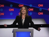 DETROIT, MICHIGAN - JULY 30: Democratic presidential candidate Marianne Williamson speaks while Rep. Tim Ryan (D-OH) listens during the Democratic Presidential Debate at the Fox Theatre July 30, 2019 in Detroit, Michigan. 20 Democratic presidential candidates were split into two groups of 10 to take part in the debate sponsored …