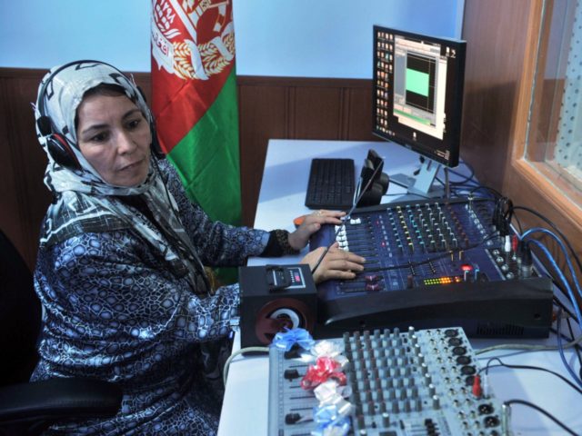 An Afghan female journalist works in the studio of "Shahrzad", the second woman's radio st