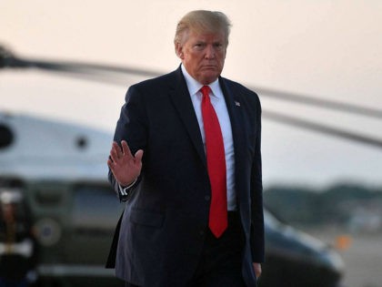 US President Donald Trump makes his way to board Air Force One before departing from Cleve