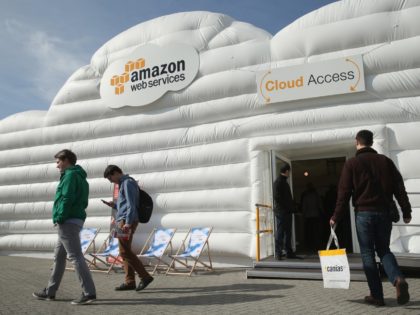 HANOVER, GERMANY - MARCH 14: Visitors arrive at the cloud pavillion of Amazon Web Services at the 2016 CeBIT digital technology trade fair on the fair's opening day on March 14, 2016 in Hanover, Germany. The 2016 CeBIT will run from March 14-18. (Photo by Sean Gallup/Getty Images)