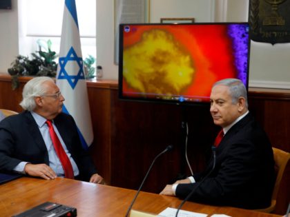 Israeli Prime Minister Benjamin Netanyahu (R) and US Ambassador to Israel David Friedman watch a video which shows the launch of the Arrow 3 hypersonic anti-ballistic missile during a cabinet meeting in Jerusalem on July 28 2019. (Photo by MENAHEM KAHANA / POOL / AFP) (Photo credit should read MENAHEM …