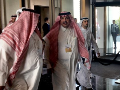 Saudi Minister of State Mohammed al-Shaikh (C) arrives for the second day of a US-sponsore