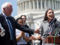 Representative Alexandria Ocasio-Cortez (2nd R), Democrat of New York, speaks alongside US Senator Bernie Sanders (2nd L), Independent of Vermont, and Representative Ilhan Omar (L), Democrat of Minnesota, during a press conference to introduce college affordability legislation outside the US Capitol in Washington, DC, June 24, 2019. (Photo by SAUL …