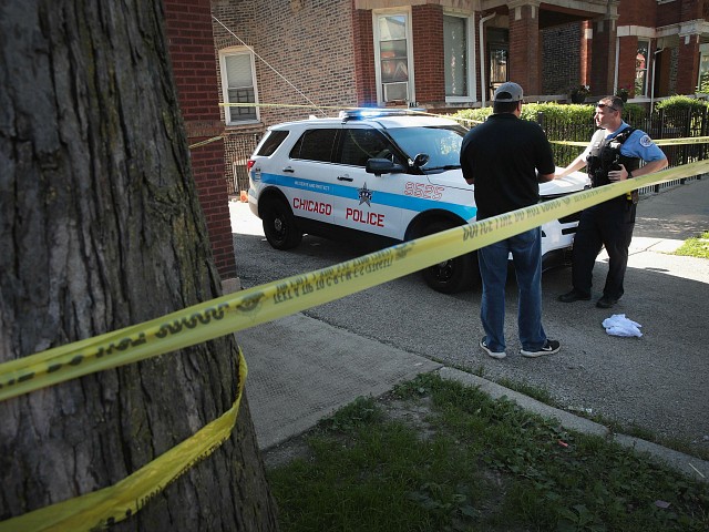 CHICAGO, IL - JULY 27: Chicago Police guard evidence near a murder scene in the Humboldt Park neighborhood on July 27, 2017 in Chicago, Illinois.  At least 400 murders have been recorded so far in 2017 in Chicago.  The city is on course to surpass last year's total of more than 750 murders, the highest number since the early 1990s. (Photo by Scott Olson/Getty Images)